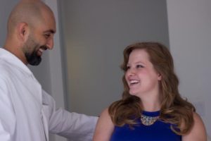 Doctor having a friendly conversation with a female patient.