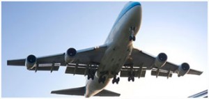 Commercial airplane flying against a clear sky.